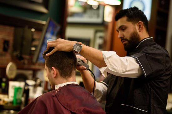 V's barber giving a hair cut