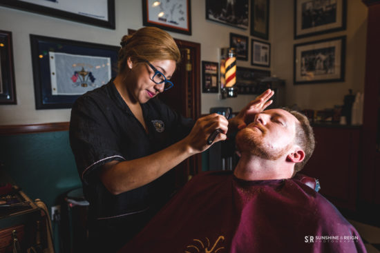 barber giving a patron a straight-razor shave